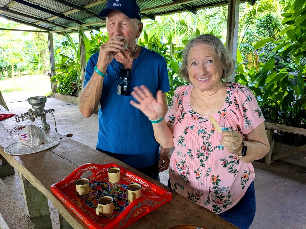 Couple enjoying locally grown cacao products during a cultural experience with Link Expeditions in Bijagua, Costa Rica.