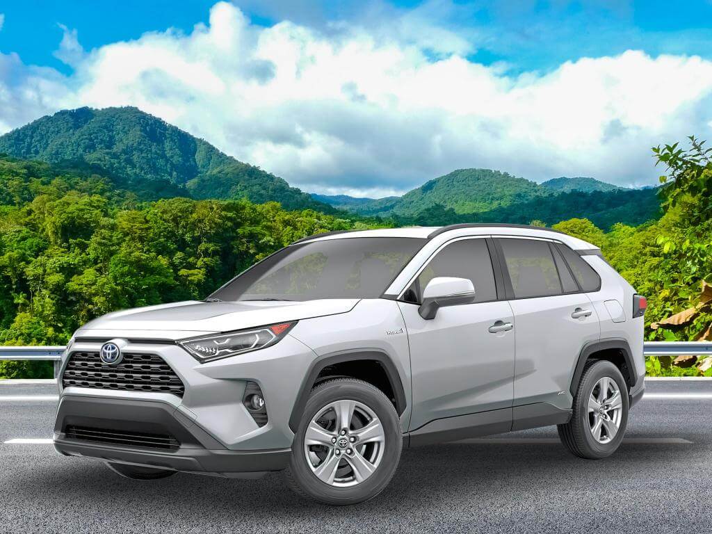 Toyota RAV4 2 rental car in a picturesque mountain setting
