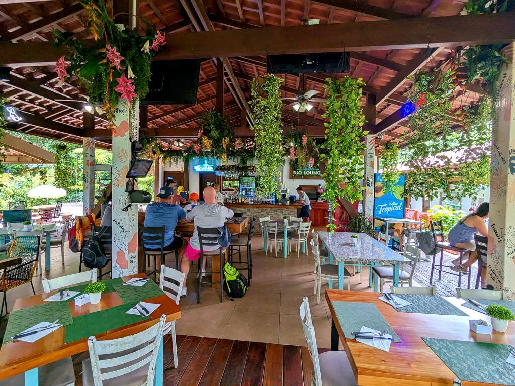 Interior view of Rio Lounge Restaurant showing tables, chairs, and the bar in the background.