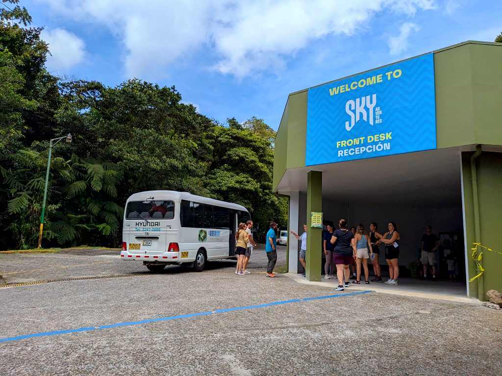 Guests arriving at the reception area and receiving instructions before the zipline tour.