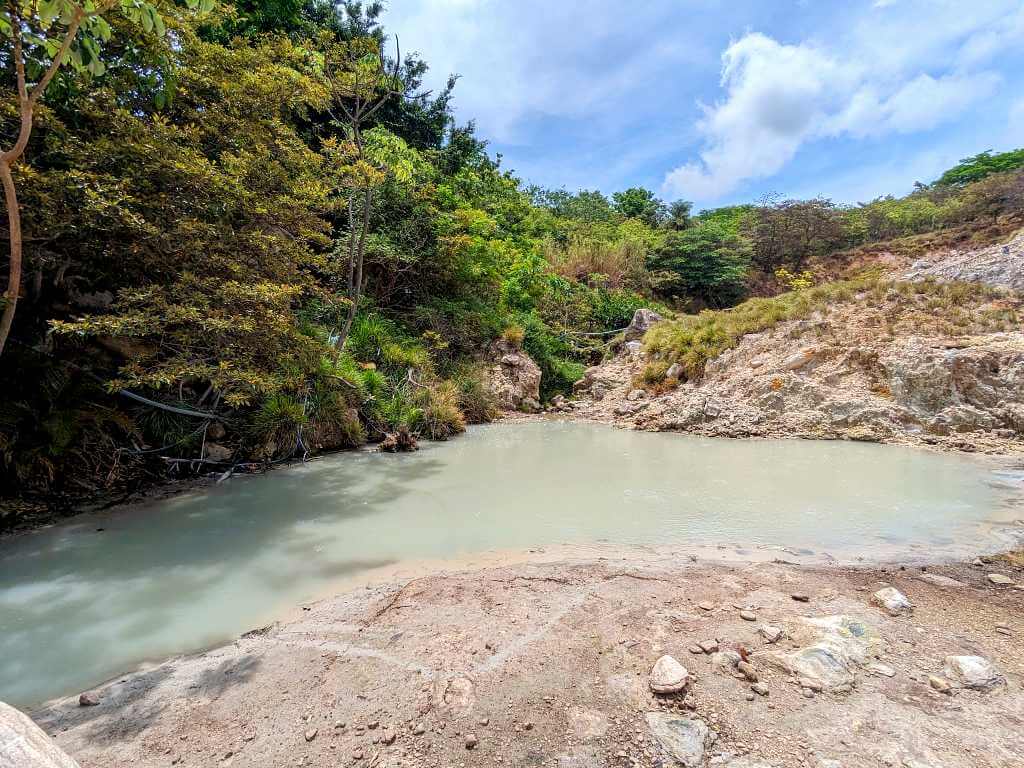 Natural hot springs at Las Hornillas, with geothermal features from the volcano.