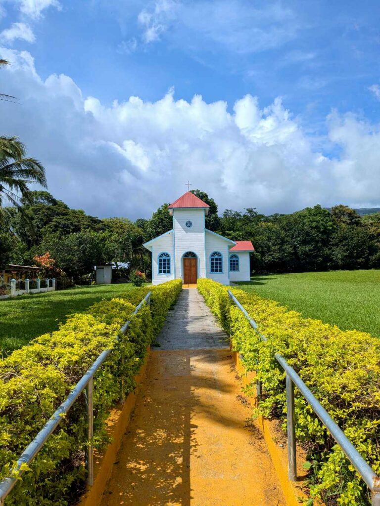 Small Catholic church with white walls and red roof in Cuipilapa, at the foothills of Miravalles Volcano.