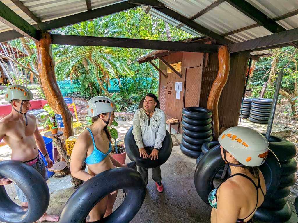 Tour guide explaining how to properly use inner tubes for the water slide at Buena Vista del Rincón.