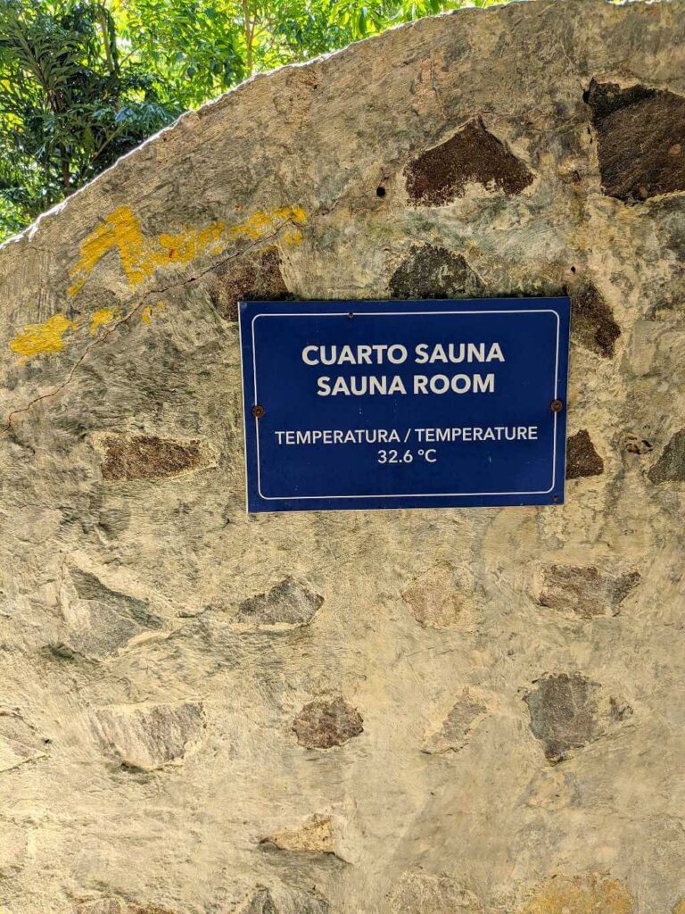 A sign for the Sauna Room at Pacaya Hot Springs indicating a temperature of 32.6°C (90.7°F).