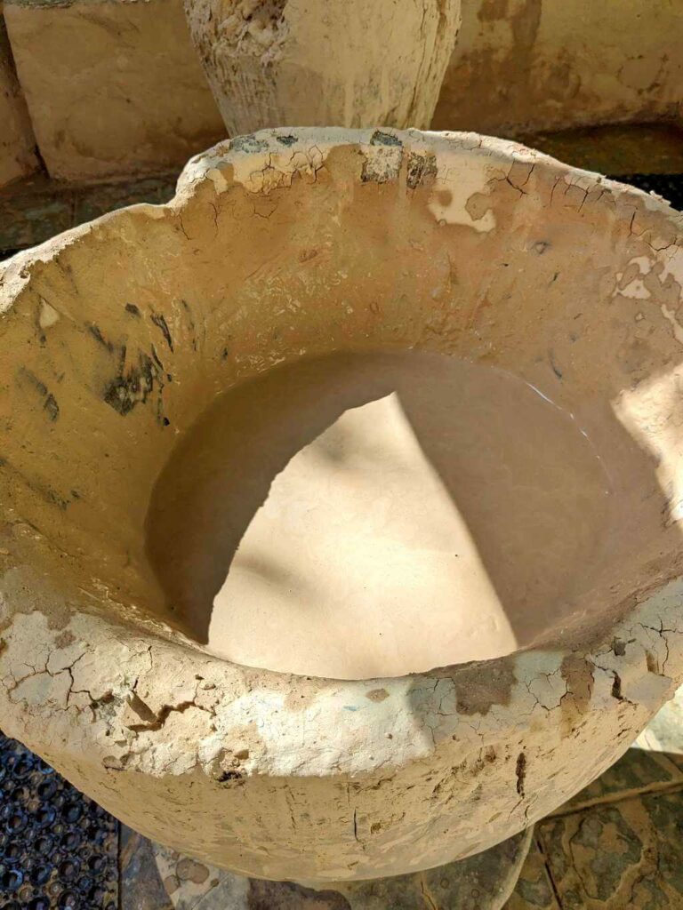 A wooden pilón containing volcanic mud at Pacaya Hot Springs, Buena Vista del Rincón.