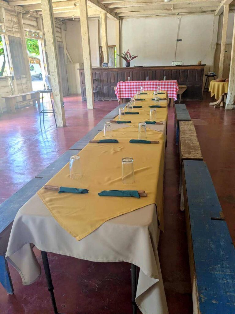 Rustic counter set up for customers to enjoy prepared dishes in a clean and orderly setting.