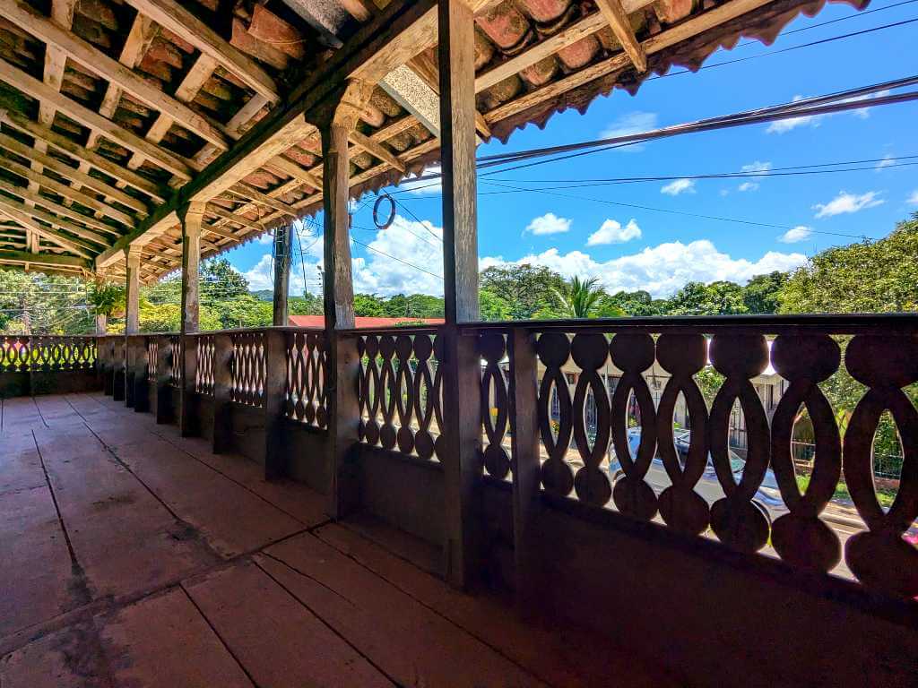 Balcony of a traditional Guanacaste house with rustic architecture.