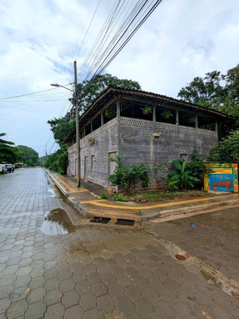 Scenic view of the road before reaching the Casona Cultural, showcasing a sign marking it as a cultural landmark.