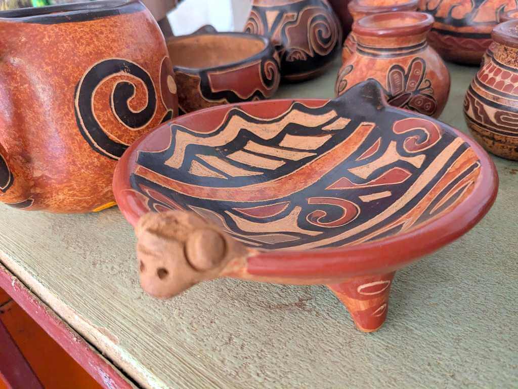 Handcrafted Chorotega pottery with vibrant hues and intricate motifs